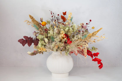 Bleached and dried neutral bouquet with a bit of color from Verbena.