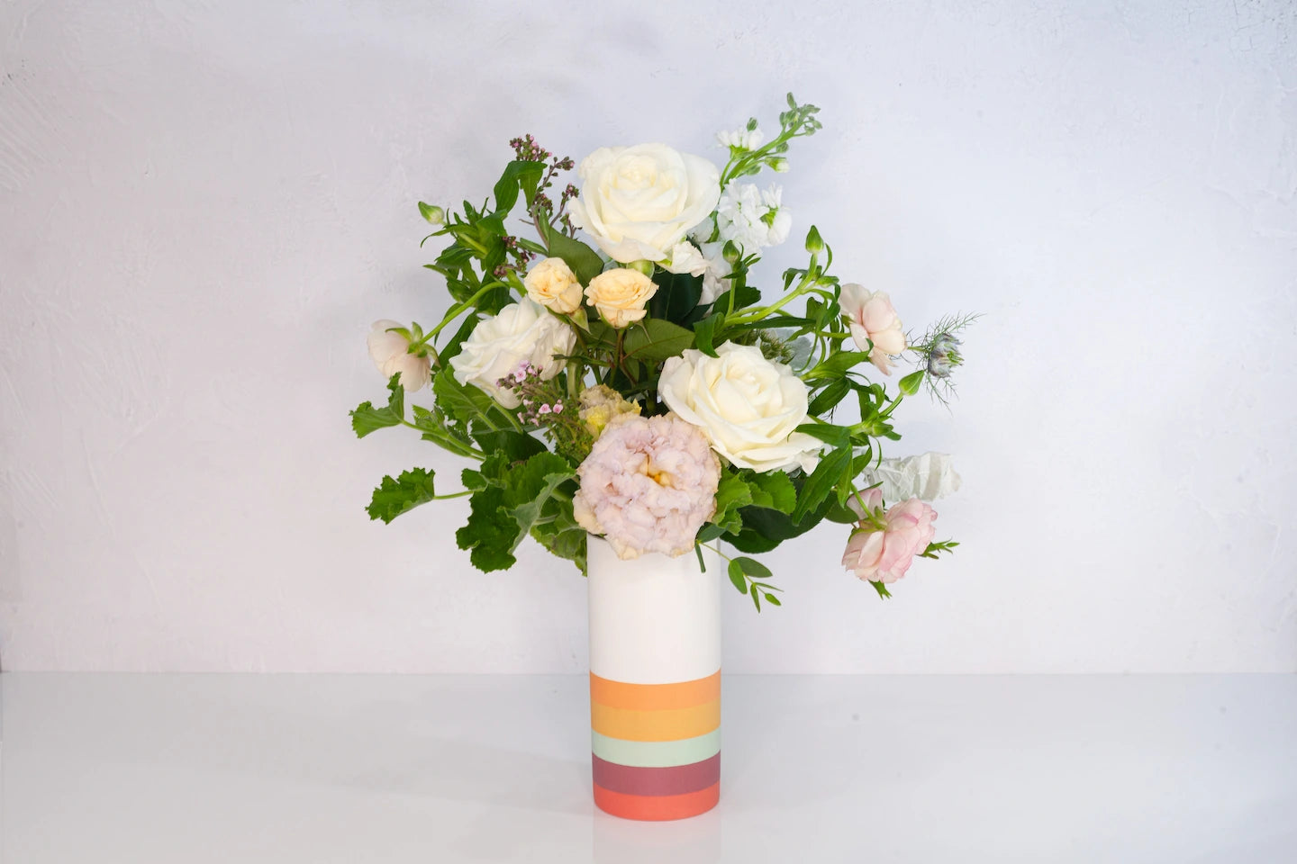 Chromo vase arrangement from Verbena with neutral flowers.